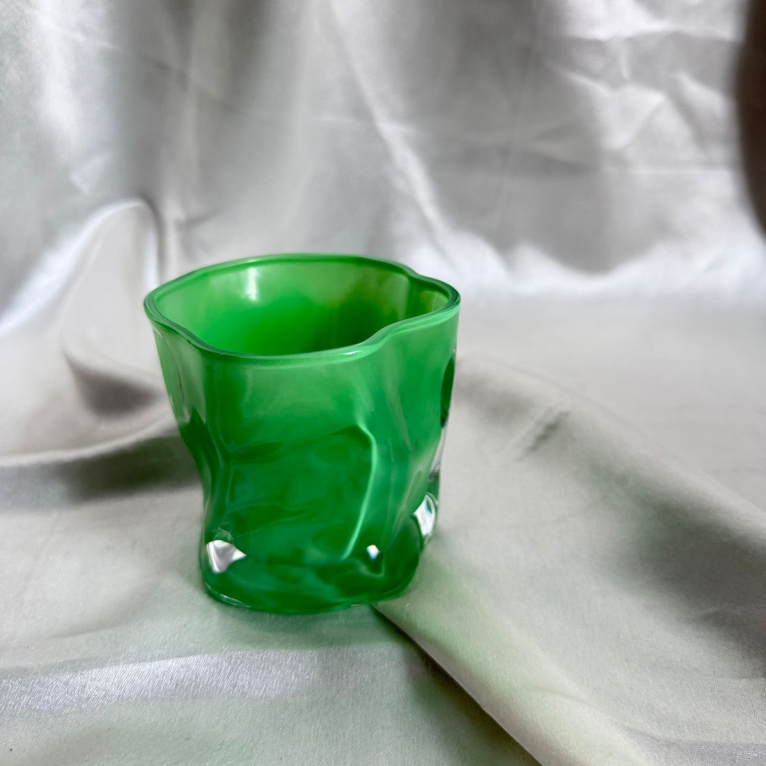 Uneven green candle glass