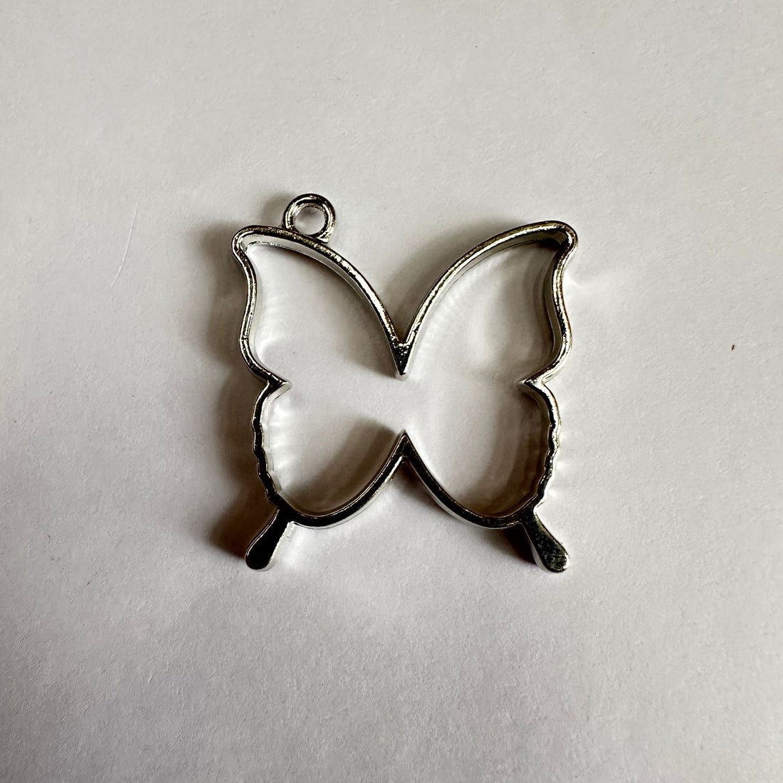 Silver butterfly bezel
