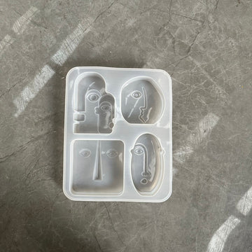 4 cavity abstract face mould