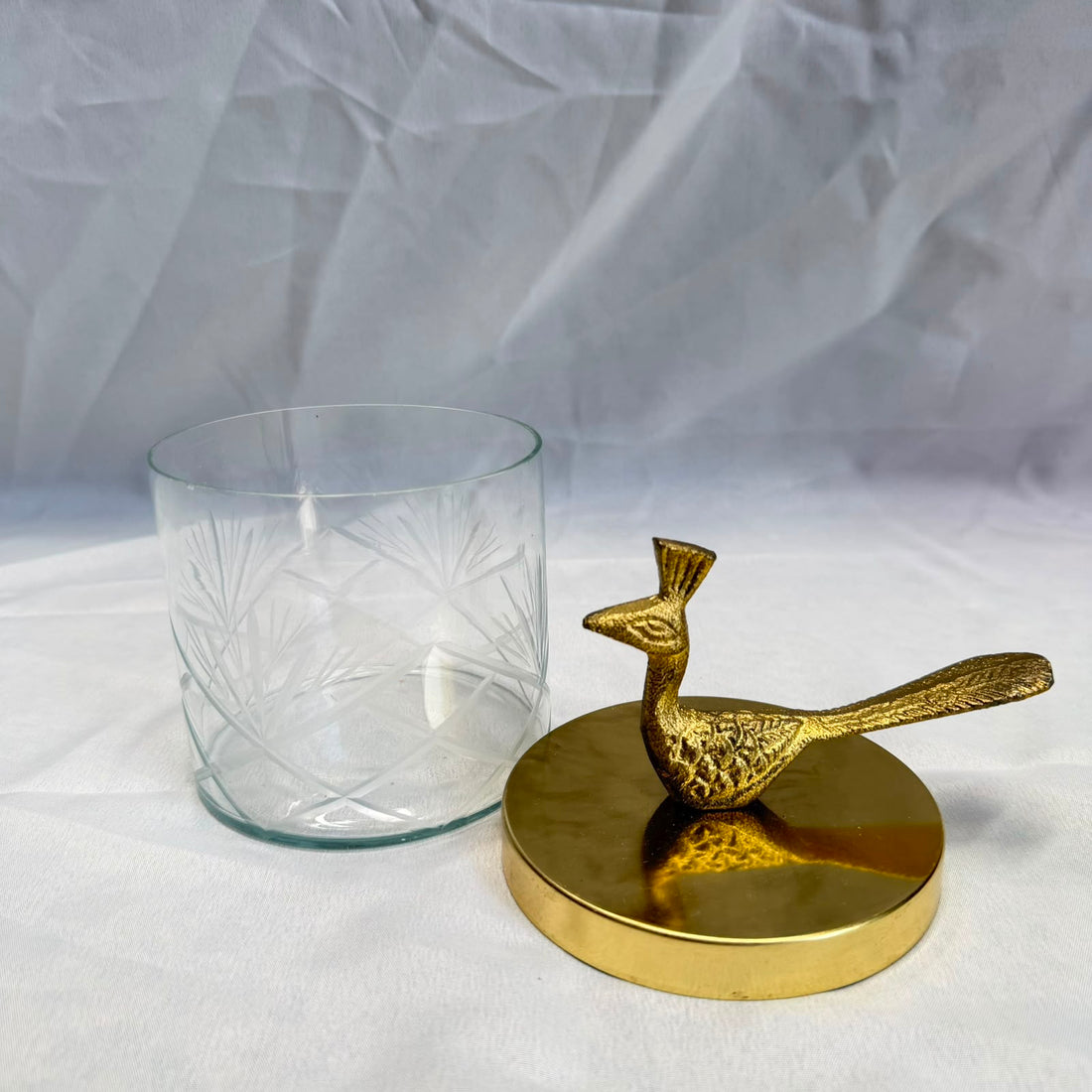 Transparent jar with peacock lid