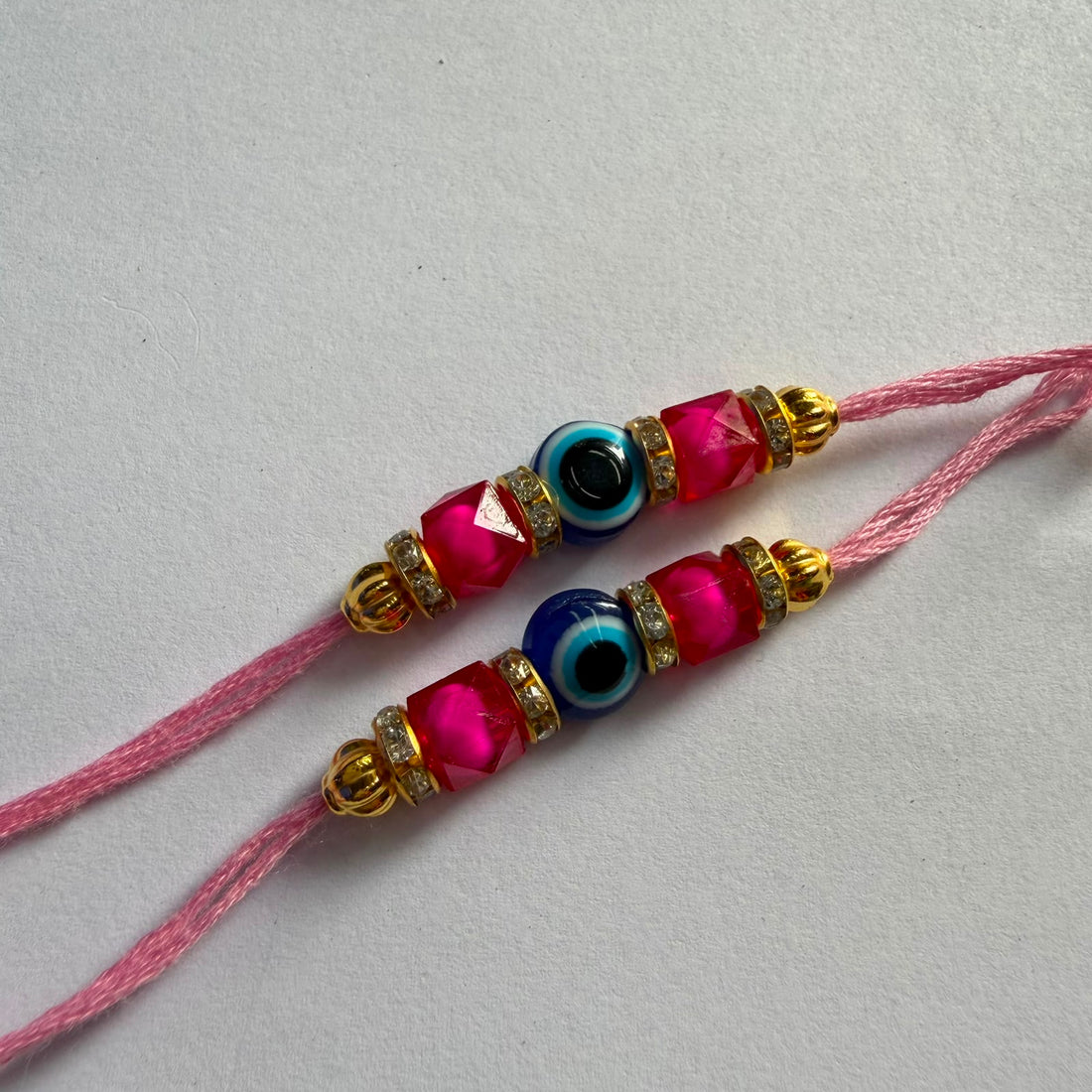 Ready Rakhi thread evil eye dark pink