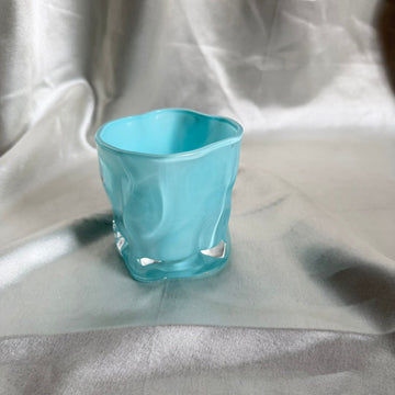 Uneven blue candle glass