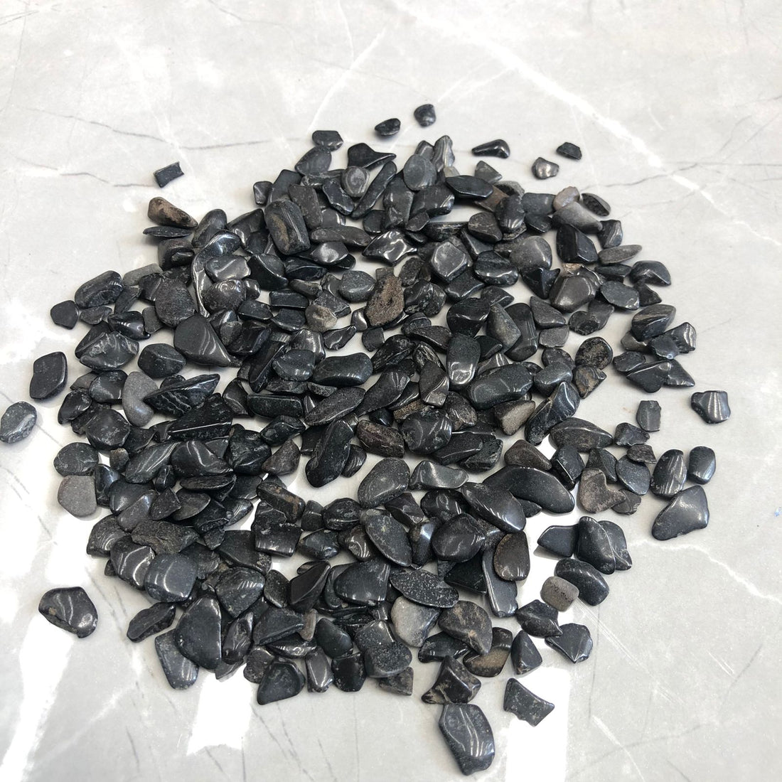 Small dark grey stone 105 gms