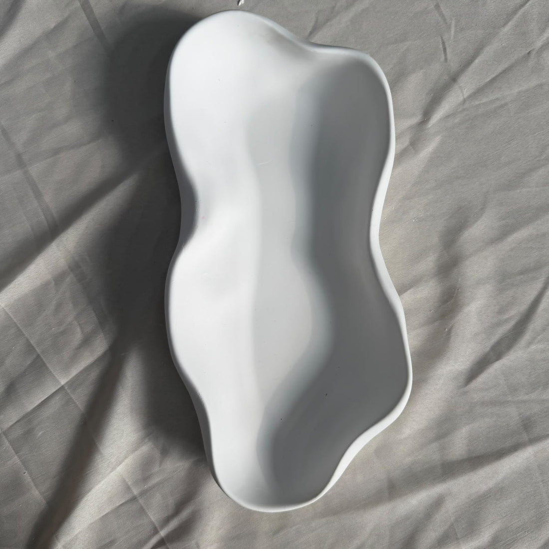 Uneven oval concrete jar