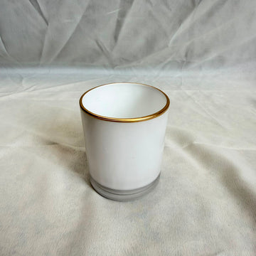 White glass jar with gold border