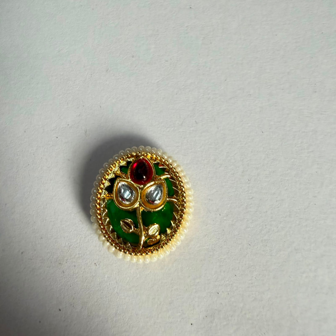 Oval Kundan rakhi charm