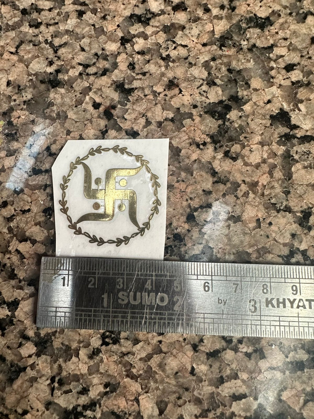 Metallic swastik sticker